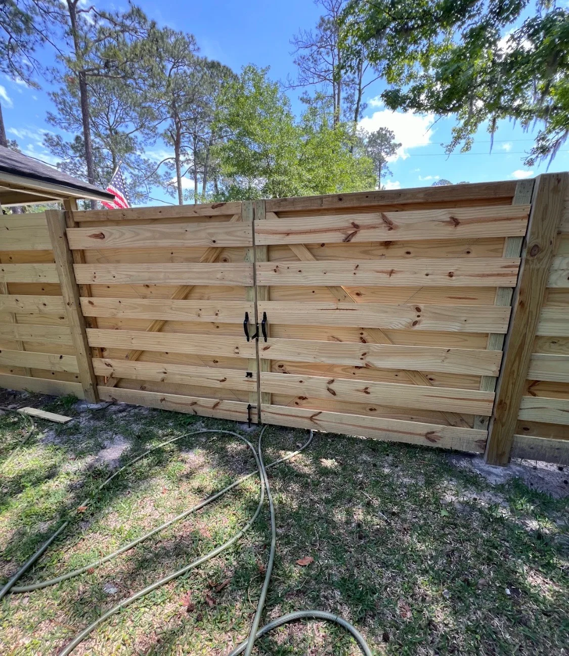 Custom double wood gate built on-site by 4 Tradesmen Fencing
