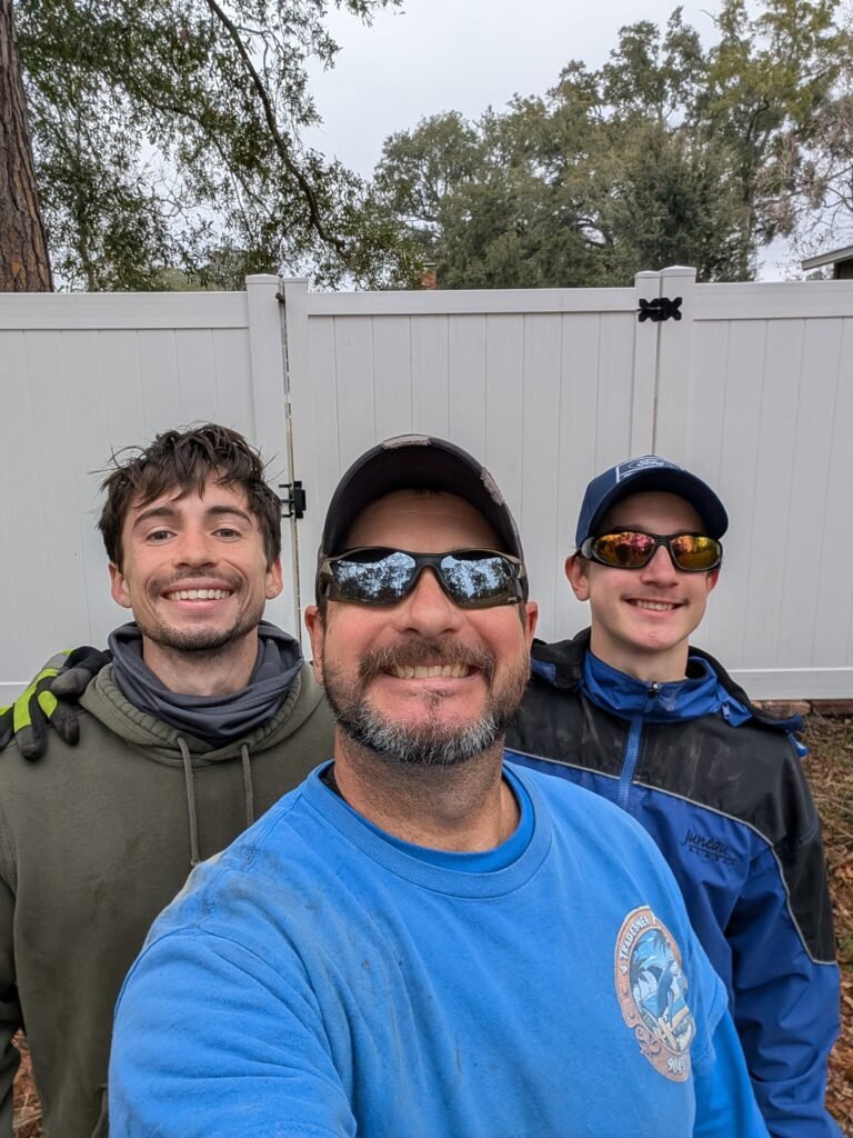Owners at 4 Tradesmen Fencing install vinyl fencing in Jacksonville FL.